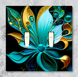 Double switch plate cover printed with a jeweled art nouveau style flower in blue and gold by Primal Painter. 