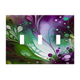 Triple switch plate cover printed with an abstract design of flowing colors in plum, greens and white by Primal Painter