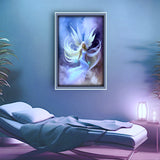 beautiful angel art by Primal Painter with a pale blue dress,white wings and hair floating in blue, purple, and white clouds framed and hanging over a massage table