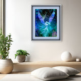 Mystical angel artwork in deep blues, purple, teal and black with an art nouveau feathery foliage border by Primal Painter displayed matted and framed on a white wall