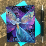 Fairy with intricate wings greeting card in rainbow colors against a blue, purple, and black background with art nouveau foliage by Primal Painter with envelope