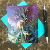 Greeting card of a white-haired, white winged fairy in a flowing dress against purple, blue and green art nouveau style foliage and flowers by Primal Painter with envelope