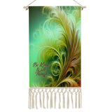 Fringed canvas wall hanging with feathery foliage artwork in greens and rust colors by Primal Painter and the affirmation "Be Kind to All Things"