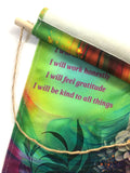 Fringed canvas wall hanging featuring the Reiki Principles and rainbow artwork called Flower Child by Primal Painter